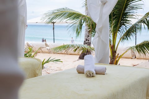 Tranquil beachfront wellness with palm trees and ocean breeze