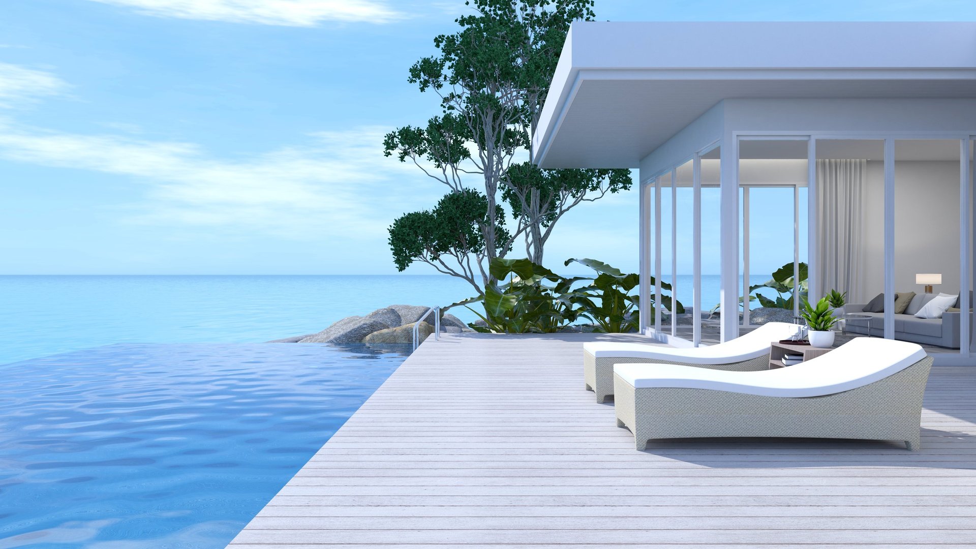 Sunbathing on seaside terrace with infinity pool and ocean view