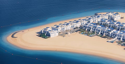 Luxury villas on sandy beach peninsula